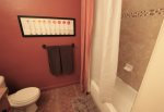 Hallway Bath Offers a Tub Shower Combination